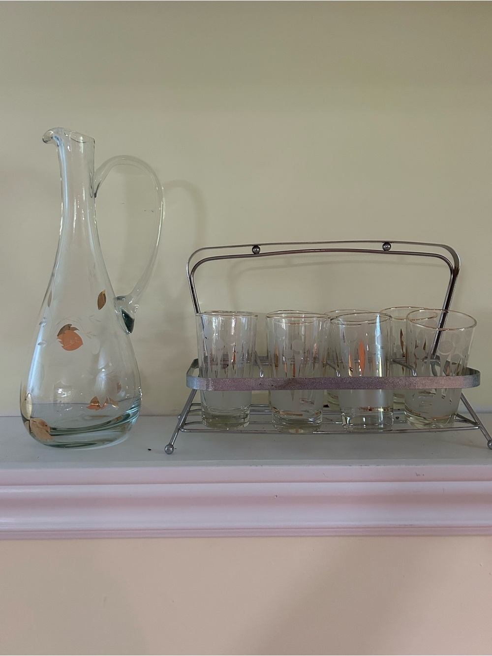 Vintage glasses, pitcher, and holder
